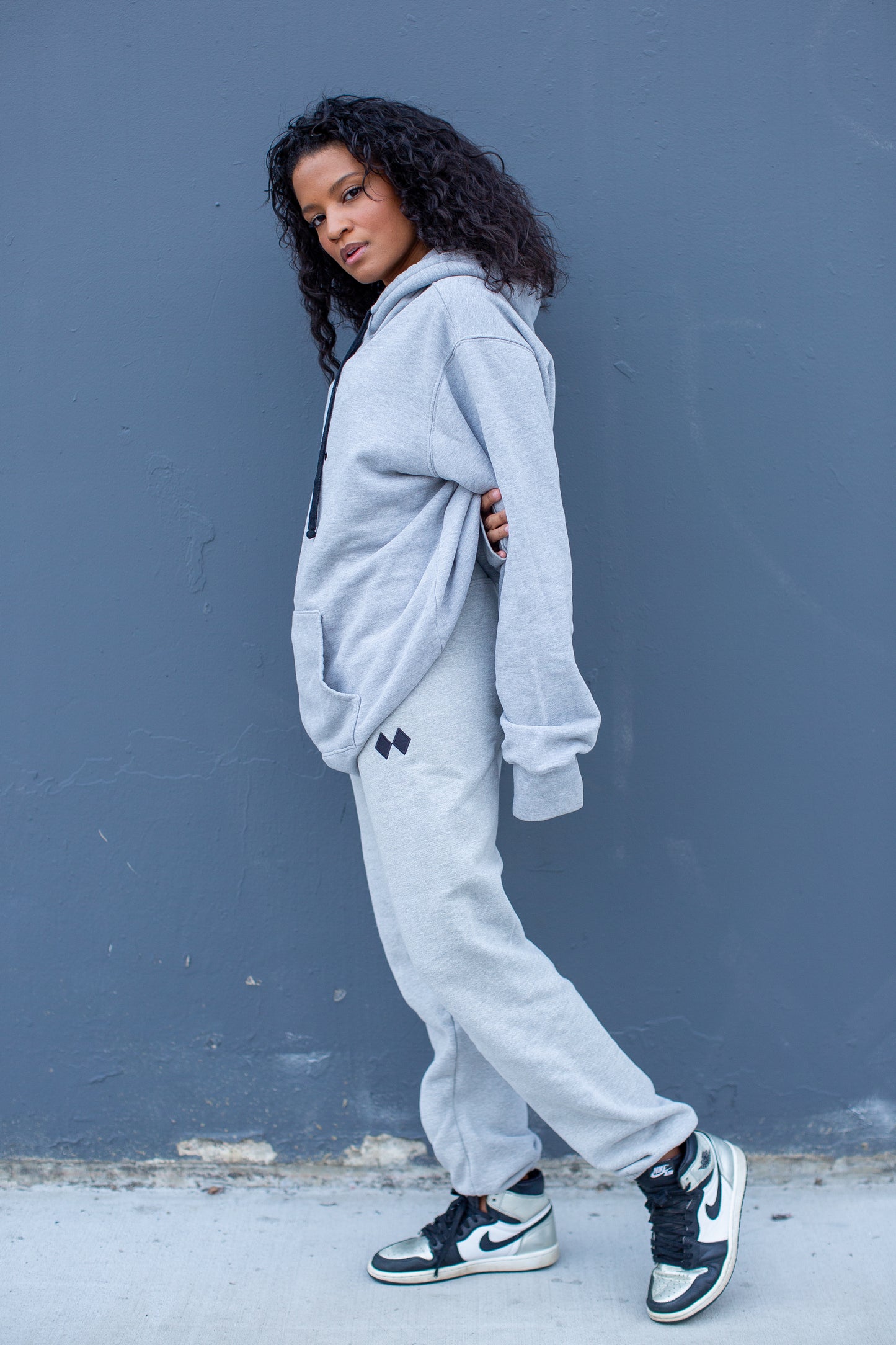 Sideview of designer Euro-fit Heather Grey sweatpants