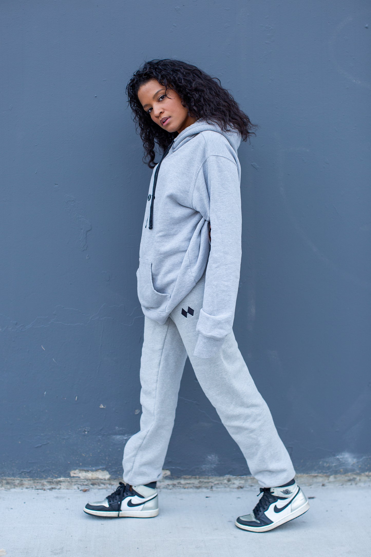 Heather Grey sweatpants styled with matching PowderLA hoodie