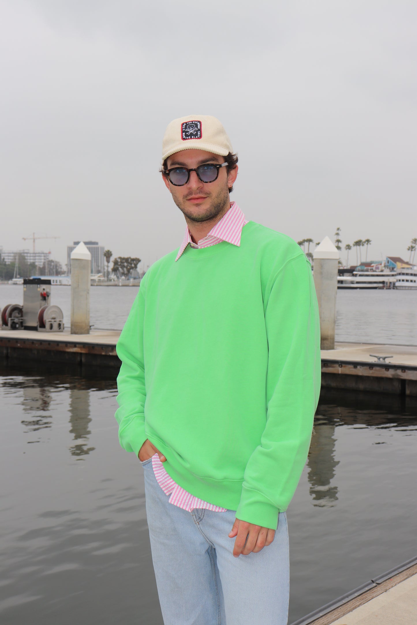 Full body shot of model in Bowie Green sweatshirt outdoors